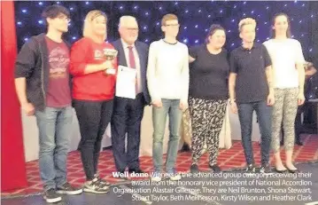  ??  ?? Well done Winners of the advanced group category receiving their award from the honorary vice president of National Accordion Organisati­on Alastair Gillespie. They are Neil Brunton, Shona Stewart, Stuart Taylor, Beth McPherson, Kirsty Wilson and...