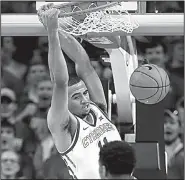  ?? AP/CHARLIE NIEBERGALL ?? Iowa State guard Talen Horton-Tucker dunks for two points Saturday during the second half of the Cyclones’ 77-60 victory over No. 5 Kansas at Hilton Coliseum in Ames, Iowa. It was Iowa State’s most lopsided victory over Kansas in 46 years.