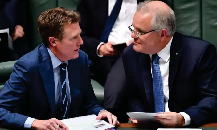  ?? Photograph: Mick Tsikas/AAP ?? Christian Porter and Scott Morrison, along with four other former ministers, will have their legal expenses related to the robodebt royal commission paid for by the public.