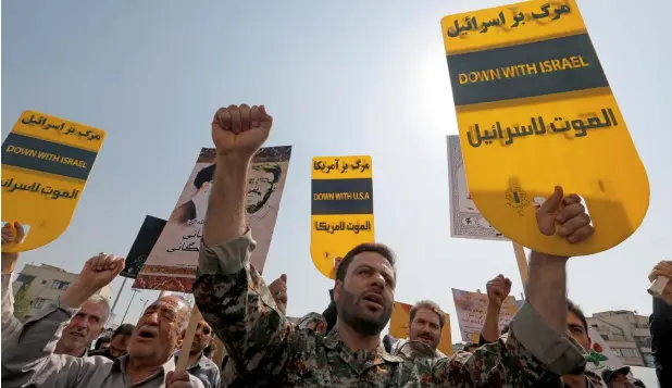  ?? —AFP file ?? Iranians protest against US President Donald Trump’s speech at the UN General Assembly, in Tehran on Sept 22. Iran’s supreme leader described the speech as full of “gangster and cowboy” rhetoric.