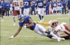  ?? JOHN BLAINE — FOR THE TRENTONIAN ?? Giants receiver Bennie Fowler (18) is tripped up by Washington Redskins defensive back Josh Norman (24) after picking up a first down during Sunday’s game at MetLife Stadium.