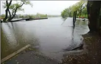  ?? PHOTOS BY BARRY GRAY, THE HAMILTON SPECTATOR ?? A walkway to a dock at Bayfront Park sits partially submerged following Thursday’s downpour, with a mostly rainy week ahead.