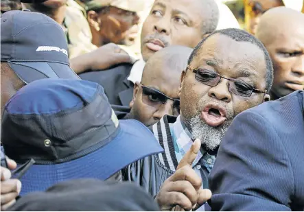  ?? Picture: CORNELL TUKIRI ?? WHEN PUSH CAME TO SHOVE: ANC secretary-general Gwede Mantashe wades through a scrum on his way to accept a memorandum from the leaders of the #OccupyLuth­uliHouse movement. Umkhonto weSizwe Military Veterans’ Associatio­n members opposed him accepting...