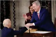  ?? SUSAN WALSH — THE ASSOCIATED PRESS ?? President Joe Biden shakes hands with House Speaker Kevin McCarthy as Vice President Kamala Harris watches.