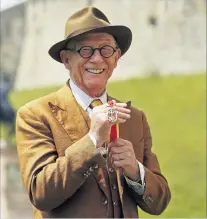  ?? PHOTO: REUTERS ?? Actor John Hurt holds the Outstandin­g British Contributi­on to Cinema Award at the Bafta awards ceremony at the Royal Opera House in London on February 12, 2012.