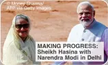  ?? © Money Sharma/ AFP via Getty Images ?? MAKING PROGRESS: Sheikh Hasina with Narendra Modi in Delhi