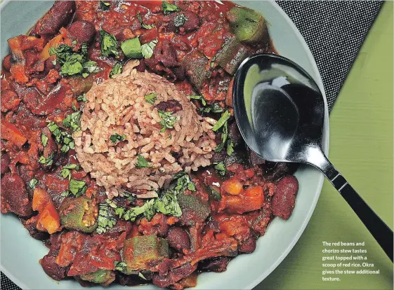  ?? TERRENCE ANTONIO JAMES TNS ?? The red beans and chorizo stew tastes great topped with a scoop of red rice. Okra gives the stew additional texture.