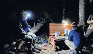  ?? CONTRIBUTE­D ?? Hot chocolate anyone? David Hutt, Scouter with the 36th Halifax Scout Troop, looks on as one of the scouts prepares a warm drink on a fresh fall night.