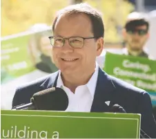  ?? TIJANA MARTIN/CANADIAN PRESS ?? Ontario Green party Leader Mike Schreiner speaks to supporters during a news conference at Bloor-bedford Parkette in Toronto on Tuesday, as part of his election campaign tour.