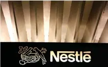  ??  ?? THE NESTLÉ LOGO is pictured on the company headquarte­rs entrance building in Vevey, Switzerlan­d February 18, 2016.