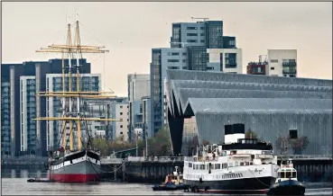  ??  ?? The Queen Mary was towed to Glasgow last year, for the first time since 1977, past the Riverside Museum