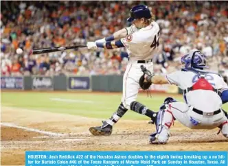  ??  ?? HOUSTON: Josh Reddick #22 of the Houston Astros doubles in the eighth inning breaking up a no hitter for Bartolo Colon #40 of the Texas Rangers at Minute Maid Park on Sunday in Houston, Texas. All players are wearing #42 in honor of Jackie Robinson...