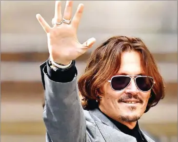  ?? AFP ?? US actor Johnny Depp gestures as he leaves the High Court after the final day of his libel trial against News Group Newspapers (NGN), in London, on Tuesday.