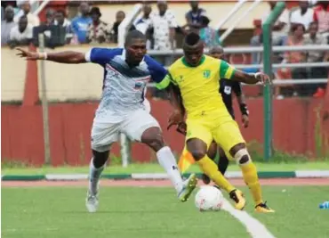  ??  ?? Plateau United's Joshua Obaje (right) tries to dribble past a Lobi Stars defender during their league match at the Aper Aku Stadium in Makurdi last season. Obaje was on target for United yesterday