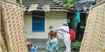  ?? (Rupak De Chowdhuri/Reuters) ?? RAFIQ KHAN, a villager, receives a dose of the COVISHIELD vaccine during a door-to-door vaccinatio­n drive at Uttar Batora Island in West Bengal, India, yesterday.