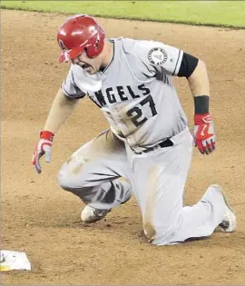  ?? Lynne Sladky Associated Press ?? THERE WAS PLENTY OF PAIN to go around, for Mike Trout and the Angels, on May 28 when he injured his thumb on the bag while stealing second base.