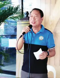  ??  ?? BARANGAY Captain Roland Trajera delivers a message at the launching