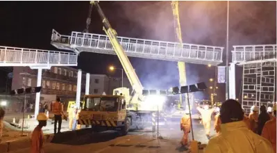  ??  ?? Lagos State government removing the dilapidate­d pedestrian bridge for replacemen­t at Fadeyi bus stop along Ikorodu road at weekend.