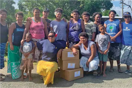  ??  ?? The Rotary Club of Lautoka (District 9920) Youth Ambassador and Projects, Melissa Natawake ( second from left, frontrow) with members of the club during their distributi­on to the different families at Malevu and Korotogo Village in Sigatoka.