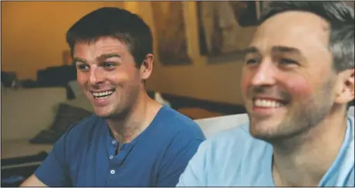  ?? (AP/Jessie Wardarski) ?? Brothers Bryan (left) and Bradford Manning laugh as they tell the origin story of their clothing company, Two Blind Brothers, in their New York City loft.