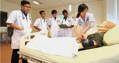  ??  ?? Students can practice medical emergencie­s on a high fidelity model at the simulation room at Newcastle University Medicine Malaysia.
