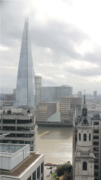  ?? RUSS PETERS ?? The Shard, the tallest building in Western Europe, dominates the view south across the Thames from the top of the Monument to the Great Fire of 1666 in downtown London. Climbing the 311 steps to the monument’s viewing platform is well worth it, and a relative bargain for London sites.