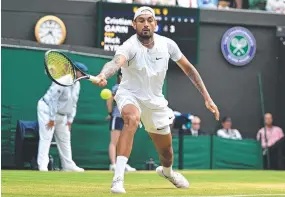  ?? ?? Australia's Nick Kyrgios returns the ball to Chile's Cristian Garin during their men's singles quarter-final at Wimbledon. Picture: AFP