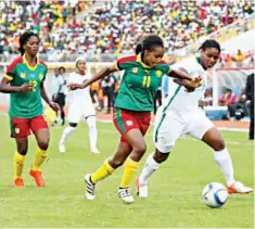  ??  ?? Desire Oparanozie of Super Falcons (right) being challenged by a Camerounia­n defender during the final of 2016 AWC in Cameroun. Nigeria won 1-0