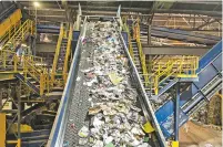  ?? WIQAN ANG/NEW YORK TIMES ?? A conveyor belt transports recycled waste for sorting at Republic Services, one of the largest waste managers in the country, in Seattle earlier this month. Plastics and papers from dozens of American cities and towns are being dumped in landfills...