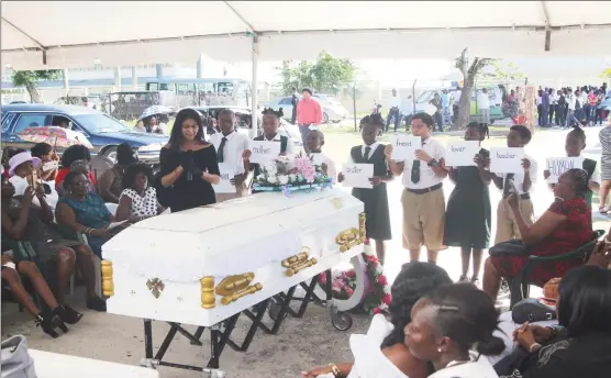  ?? (Keno George photo) ?? Miss Indigenous Heritage Sherry-Ann Balkaran and students of the Richard Ishmael Secondary School as they paid tribute to Kescia Branche yesterday.