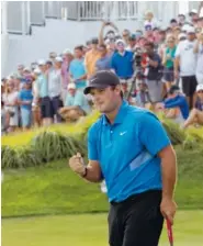  ?? AP PHOTO/MARK LENNIHAN ?? Patrick Reed pumps his fist on the 18th hole after winning the Northern Trust on Sunday at Liberty National Golf Course in Jersey City, N.J.