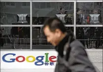  ?? ANDY WONG / AP ?? A security guard walks past Google China headquarte­rs in Beijing in 2010. Google withdrew its search engine from the country that year after it suffered what it called a cyberattac­k.