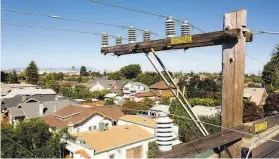  ?? Noah Berger / Special to The Chronicle ?? Power lines are seen in Alameda. Customers throughout the region could face PG& E shutoffs intended to reduce the risk of a blaze that may be sparked by an electrical line or a piece of equipment.