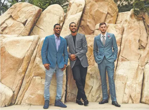  ??  ?? Nuggets first-round draft pick Tyler Lydon, right, posing with fellow new Nuggets Monte Morris, left, and Trey Lyles, has been an outdoorsma­n for as long as he can remember. The more difficult part of adapting to life in Denver will be proving his...