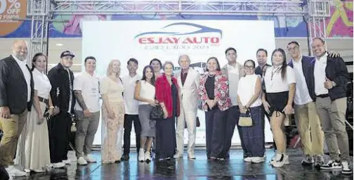  ?? ?? The San Juan brood on stage for a family photo at SM Fairview where the Esjay Auto Group Auto Expo was held.