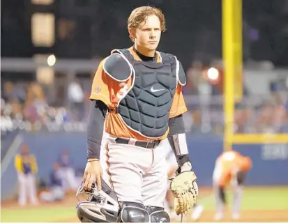  ?? CASEY GOWER ?? Norfolk Tides catcher Adley Rutschman during a game against the Nashville Sounds. Rutschman, the top prospect in baseball, is one step away from making his highly anticipate­d major league debut.