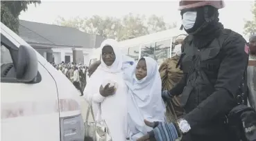  ??  ?? 0 Some of the students abducted by gunmen wait for a medical check-up after their release
