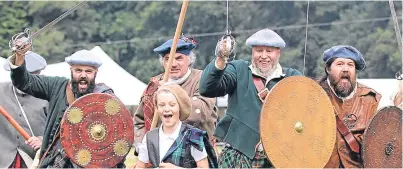  ??  ?? Battle re-enactors the Soldiers of Killiecran­kie in full cry on the battlefiel­d at a recent event.