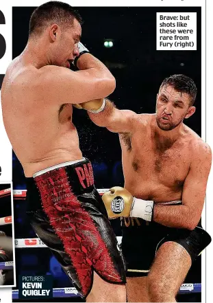  ??  ?? Family affair: the portly Tyson Fury gets involved at ringside Brave: but shots like these were rare from Fury (right) KEVIN QUIGLEY PICTURES: