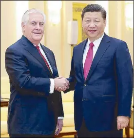  ??  ?? Chinese President Xi Jinping welcomes US Secretary of State Rex Tillerson before their meeting at the Great Hall of the People in Beijing yesterday.