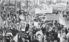  ?? LEWIS JOLY AP ?? Protesters in Paris march Saturday during nationwide demonstrat­ions against plans to change France's retirement age from 62 to 64. Further protests are planned Thursday.