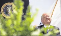  ?? DREW ANGERER / GETTY IMAGES ?? President Donald Trump attends the commenceme­nt ceremony at the U.S. Coast Guard Academy in New London, Conn., on Wednesday.