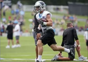  ?? CHUCK BURTON — THE ASSOCIATED PRESS ?? Carolina Panthers running back Christian McCaffrey goes through a drill Thursday at Wofford College in Spartanbur­g, S.C. McCaffrey is already turning heads at training camp where veterans are singing his praises.