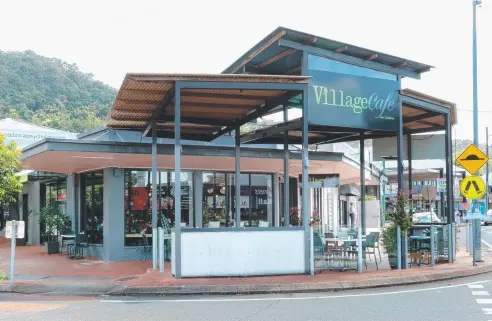  ??  ?? UP FOR SALE: Village Cafe on Collins in Edge Hill is on the market, in a prime position and currently serving breakfast and lunch.