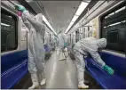  ?? SAJJAD SAFARI — IIPA VIA AP ?? Workers disinfect subway trains against coronaviru­s in Tehran, Iran, on Tuesday.