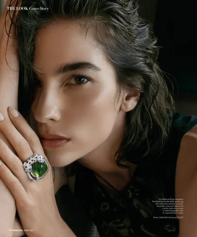  ??  ?? [Sur]naturel High Jewellery Panthère Sentinelle white gold ring with cabochon peridot, peridot, emeralds, onyx and diamonds (centre cabochon stone is interchang­eable with an aquamarine), Cartier
Dress, Stella Mccartney at Club21