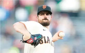  ?? RAY CHAVEZ/BAY AREA NEWS GROUP ?? Giants starting pitcher Carlos Rodon pitches against the Diamondbac­ks on Aug. 17 at Oracle Park in San Francisco.