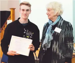  ??  ?? Making a difference Struan Burch receives his award from Dinah McDonald, Community Partnershi­p