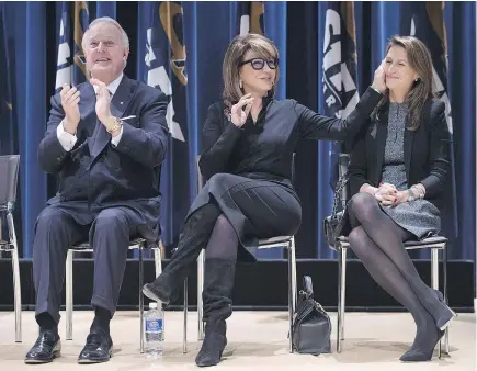  ?? — CP FILES ?? Caroline Mulroney, right, shares the stage with her father, former prime minister Brian Mulroney, left, and mother, Mila, at St. Francis Xavier University in Antigonish, N.S. last year. Caroline Mulroney announced Wednesday that she is entering...