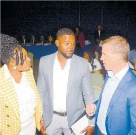  ?? CONTRIBUTE­D ?? Mayor of Montego Bay, Richard Vernon (centre), interacts with Chairman of the Jill Stewart MoBay City Run, Janet Silvera (left), and Executive Chairman of Sandals Resorts Internatio­nal, Adam Stewart, during the launch of the 2024 staging of the event at the Holiday Inn in Rose Hall, St James, recently.
